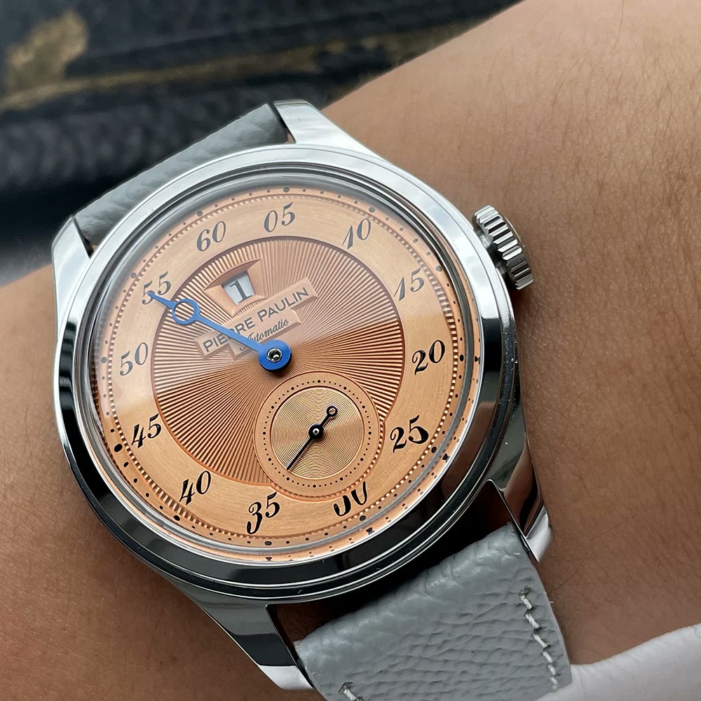 Montre Pierre Paulin Jumping Hour avec cadran saumon et style vintage